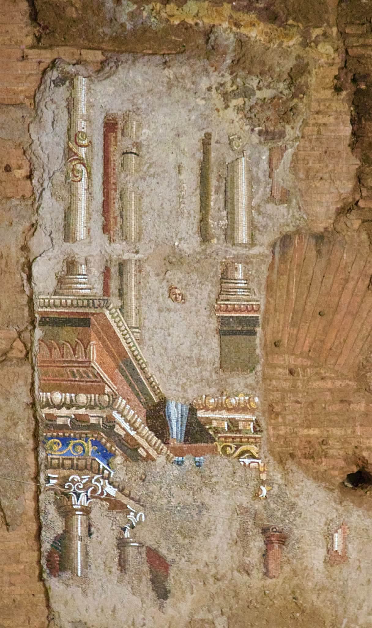 Fragment of ancient wall decoration in the Baths of Trajan underground gallery