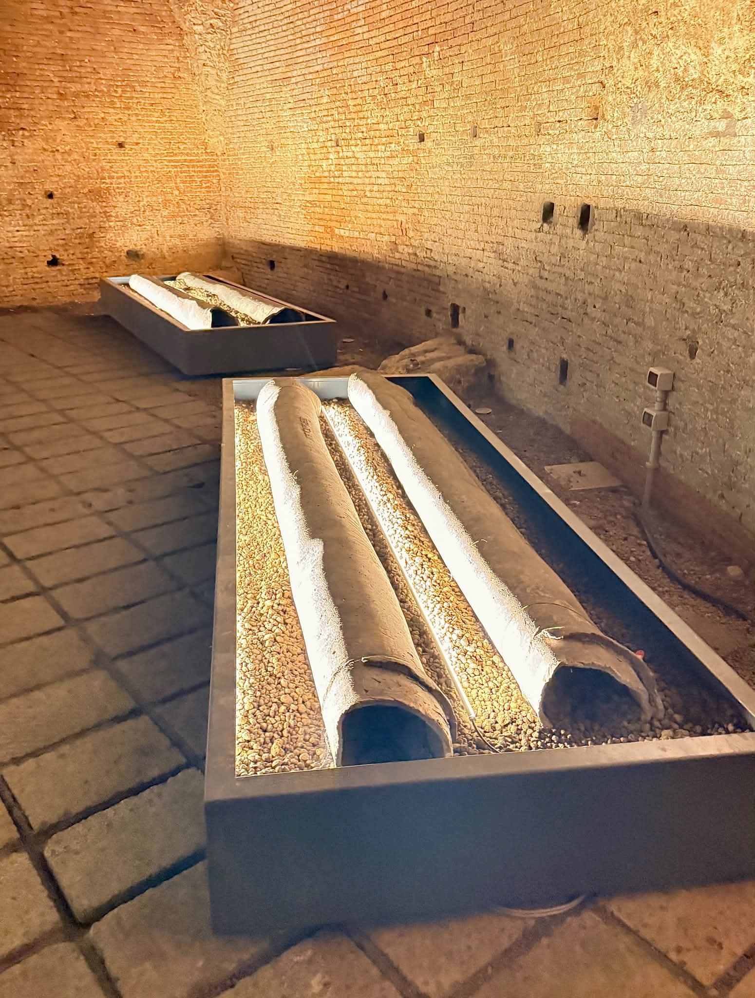 Interior view of the underground Baths of Trajan with ancient brick walls