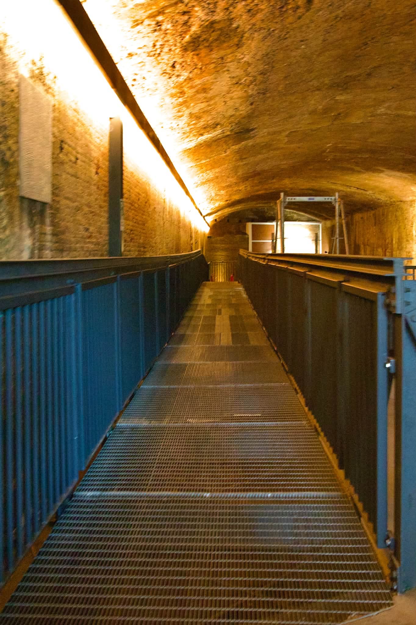 Stone archaeological remains displayed inside the Baths of Trajan underground gallery