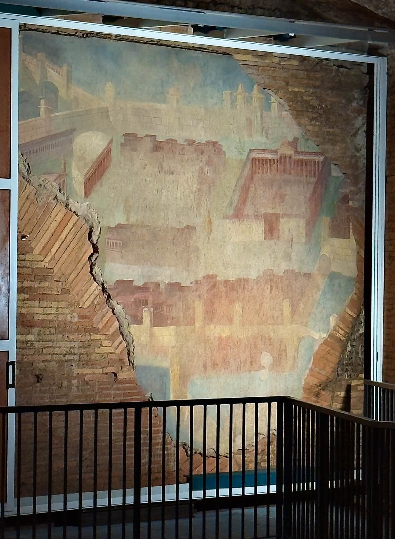 Painted City fresco depicting buildings and walls inside the Baths of Trajan