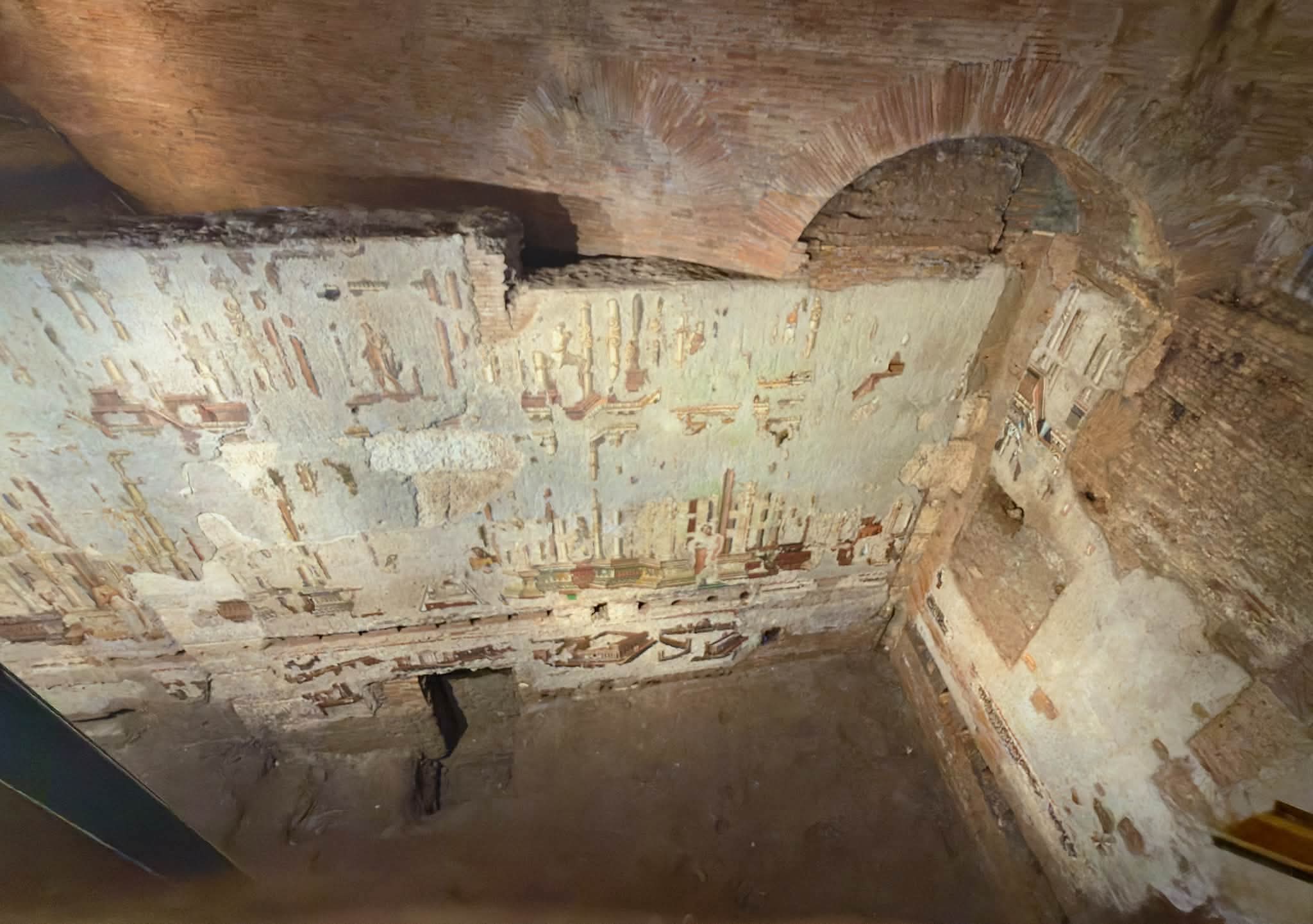 Painted City fresco and brickwork in the underground Baths of Trajan