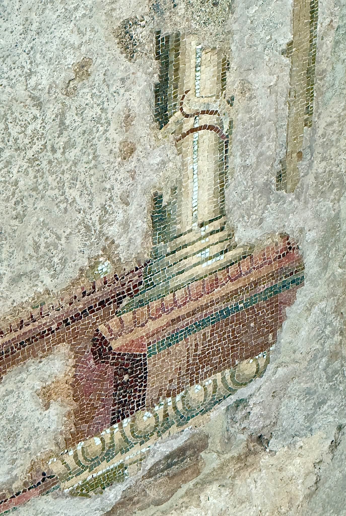 Geometric mosaic border and architectural detail at the Baths of Trajan
