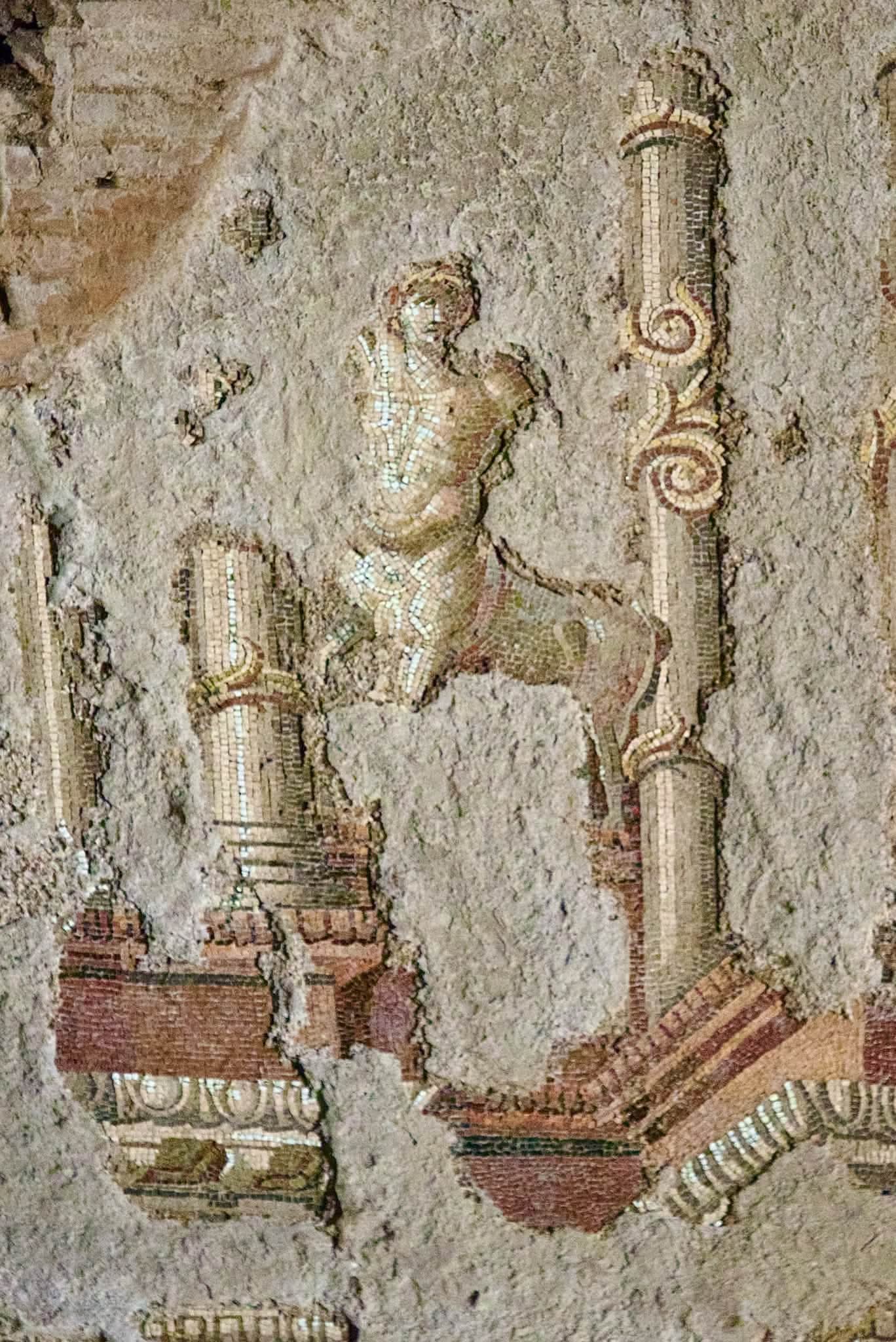 Figure in a wall mosaic inside the Baths of Trajan underground gallery